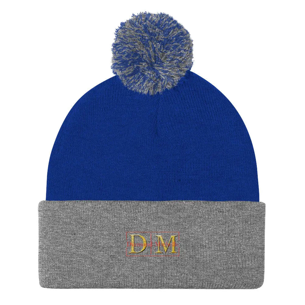Flat front view of a royal blue and heather grey DM Pom-Pom Beanie on a white background