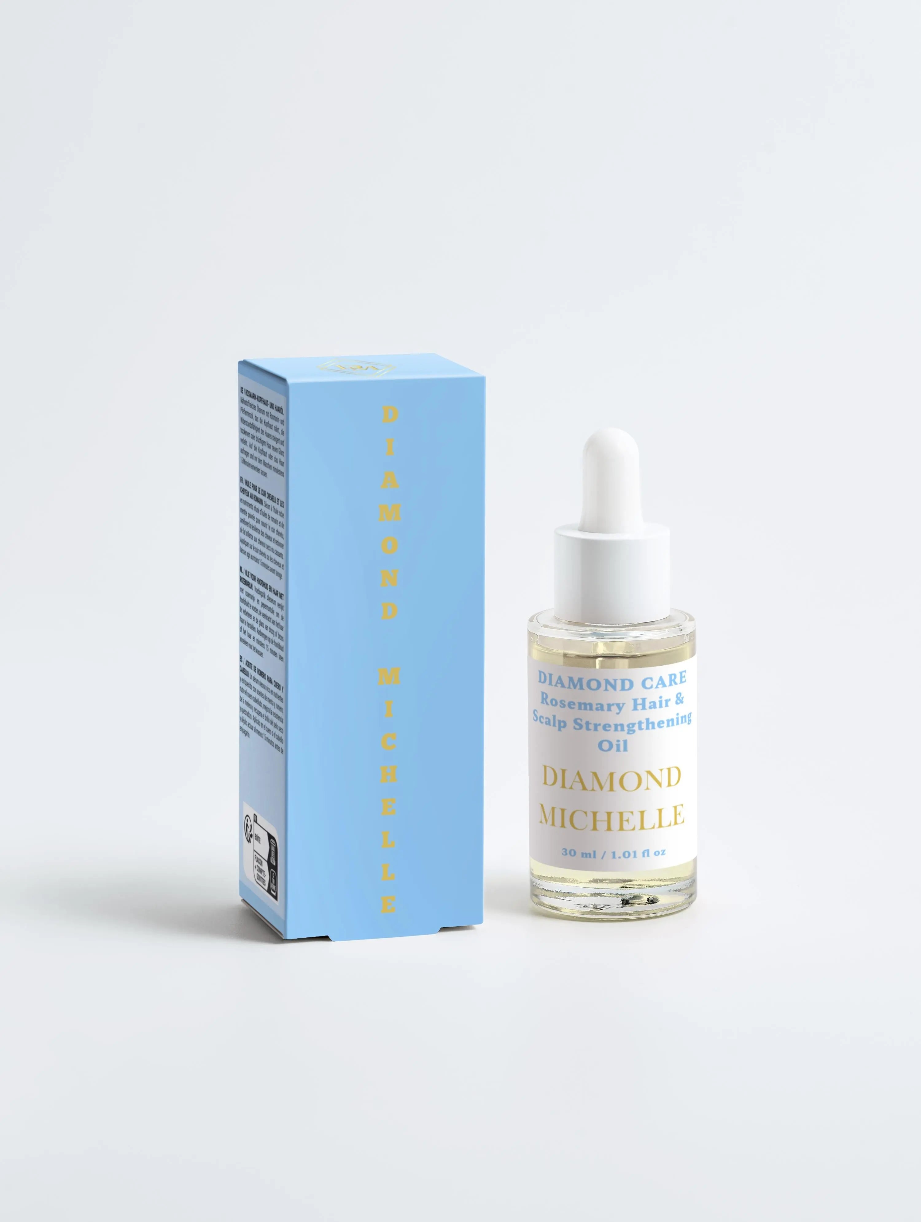 Diamond Michelle hair oil bottle and packaging on a light gray background (front view)