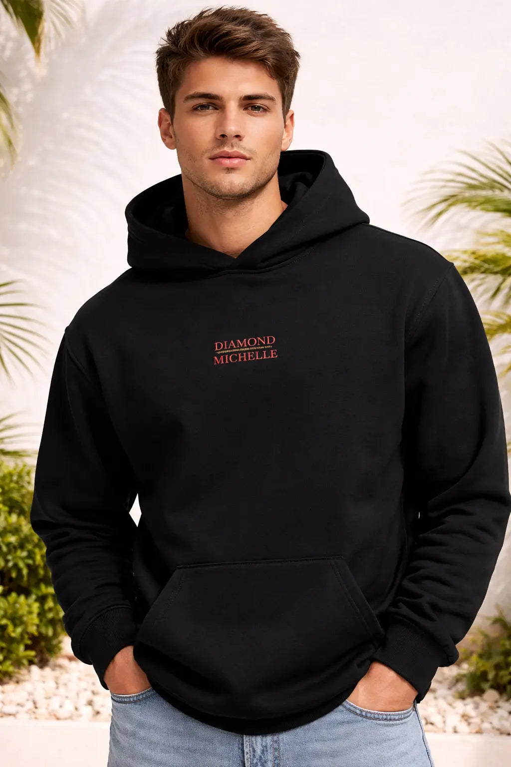 Man wearing a black hoodie with 'Diamond Michelle' logo against a nature background