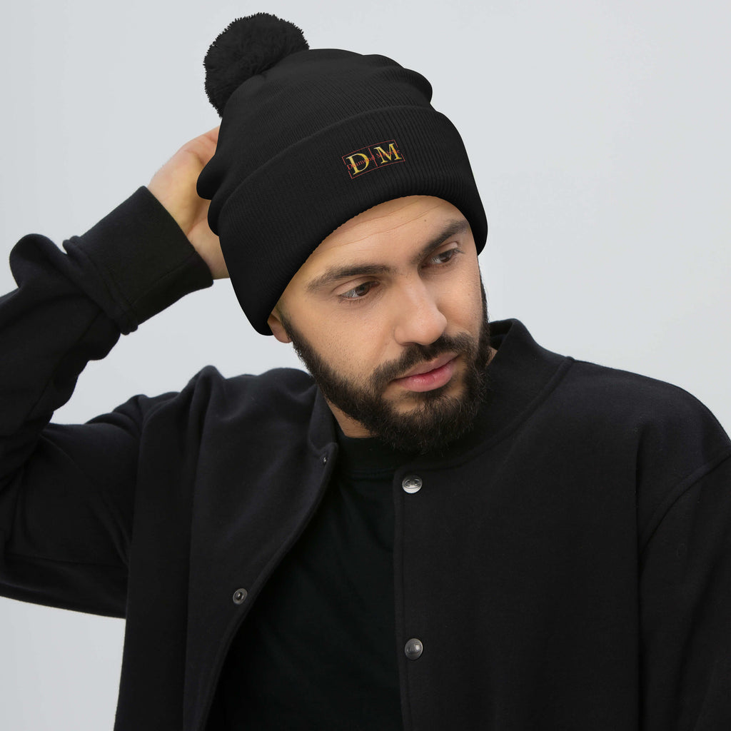 Man wearing a black DM Pom-Pom Beanie front view