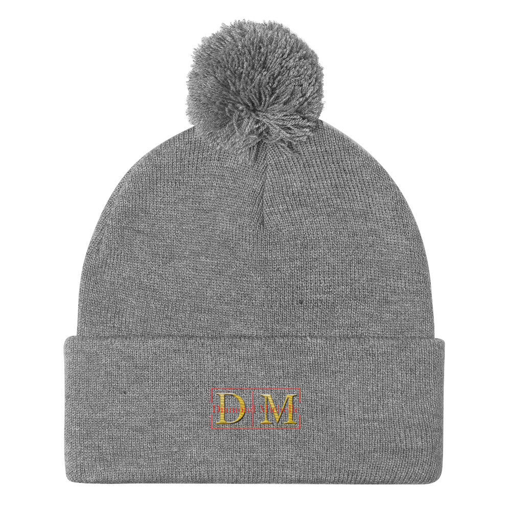Flat front view of a heather grey DM Pom-Pom Beanie on a white background