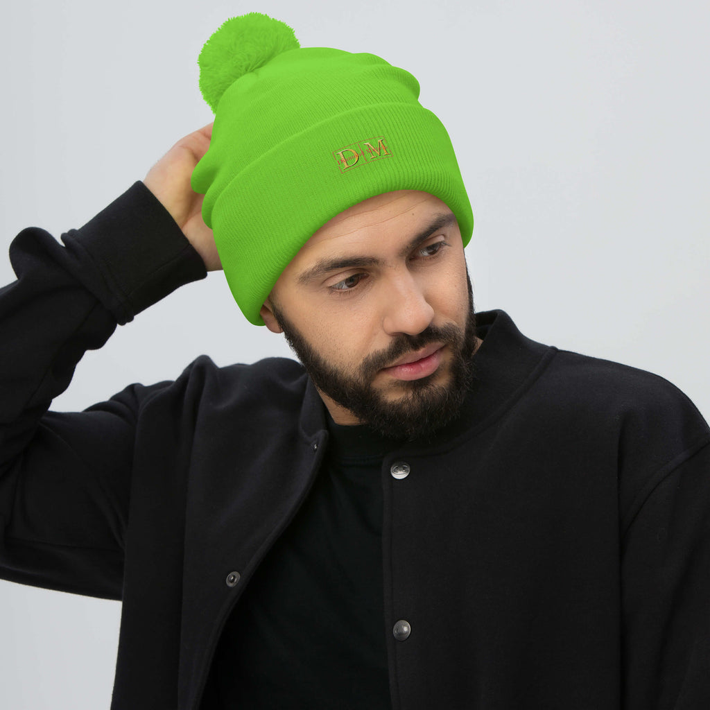 Man wearing a neon green DM Pom-Pom Beanie front view