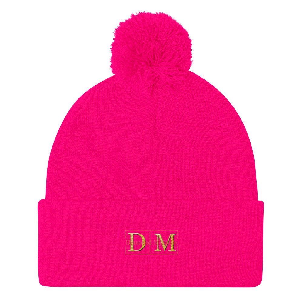 Flat front view of a neon pink DM Pom-Pom Beanie on a white background