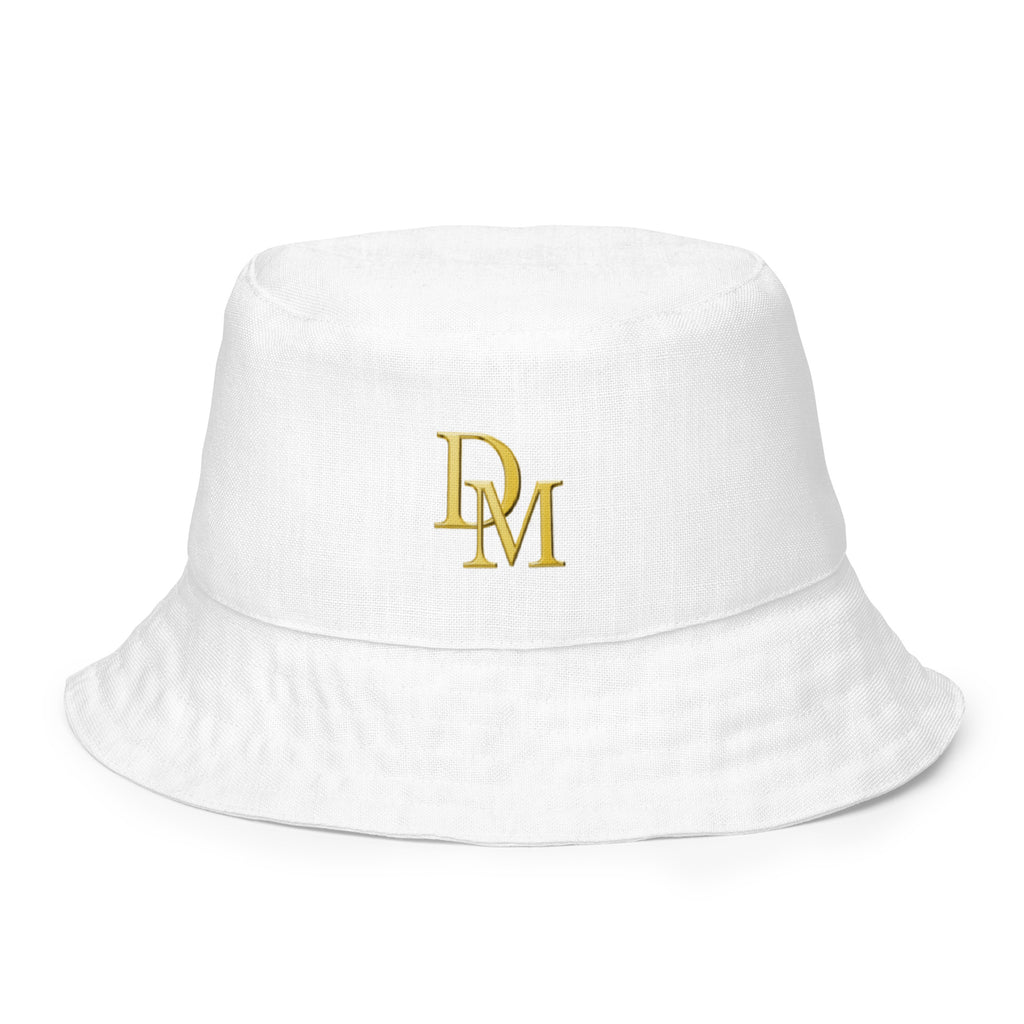 White bucket hat with gold logo on a white background