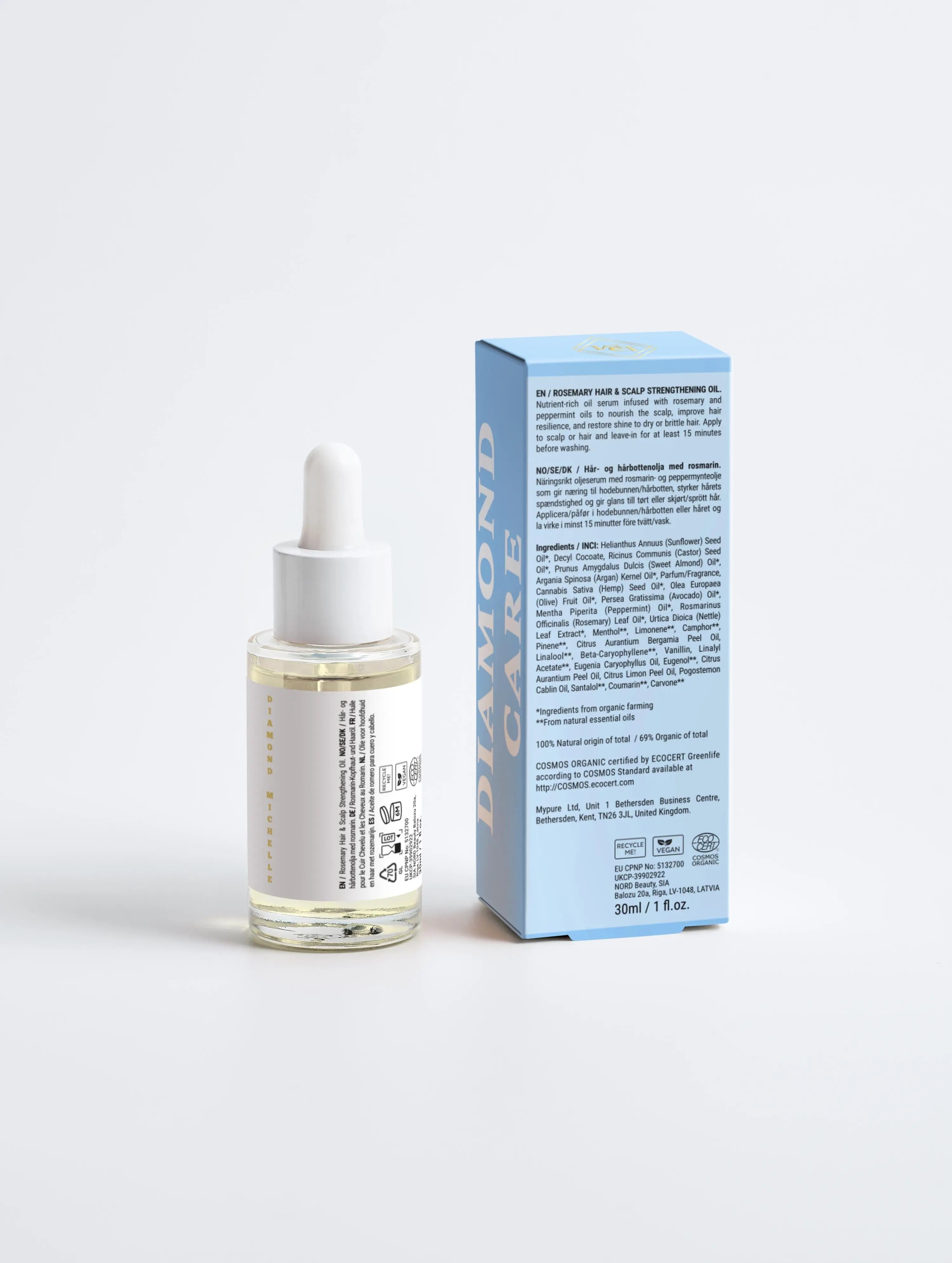 Diamond Michelle hair oil bottle and packaging on a light gray background (back view)