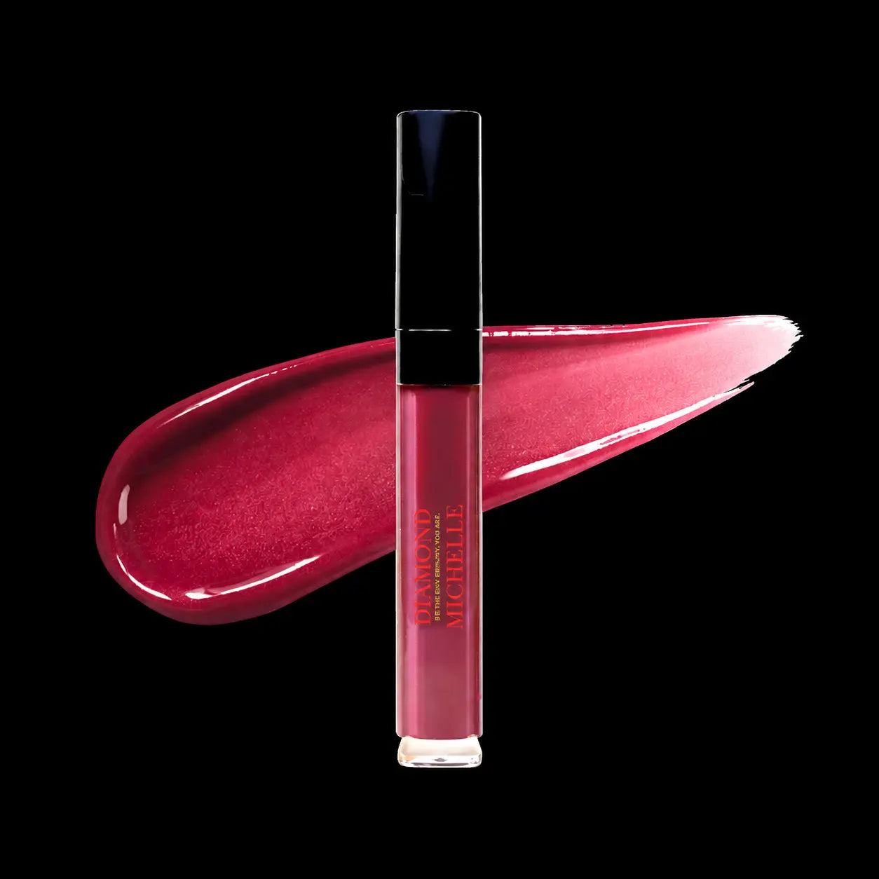 Diamond glow huckle berry pie lip oil with a swatch on a black background