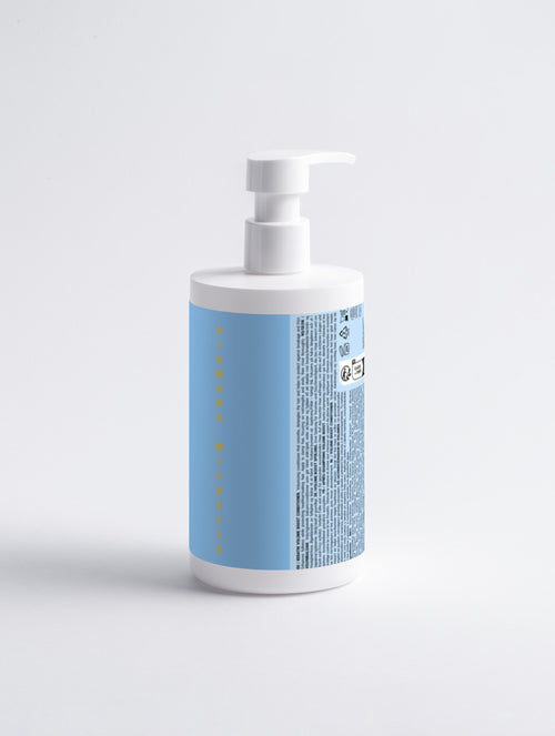 White bottle with a blue label on a light gray background